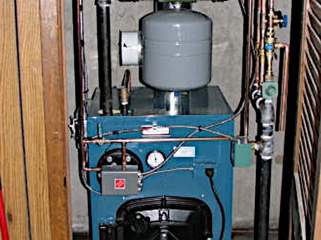 Oil-fired boiler installed in a finished basement closet
